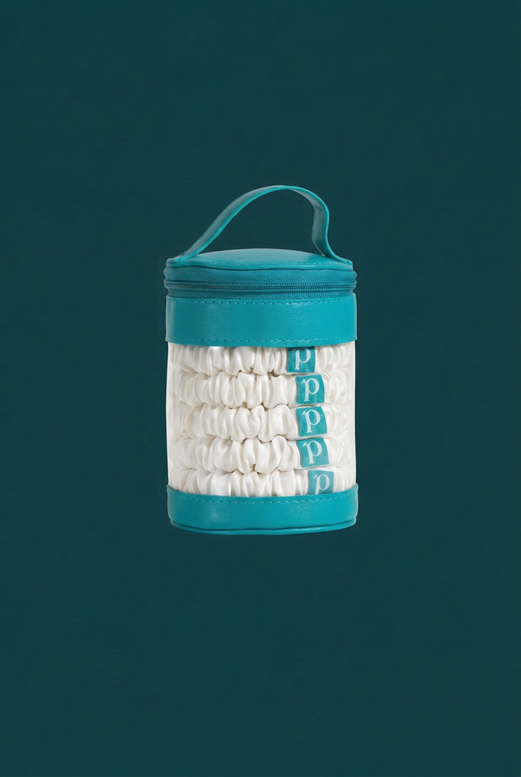 A teal and clear cylindrical storage container with a top handle, filled with white rolled cotton pads. The container has teal bands at the top and bottom and a clear front panel showing the white pads inside.